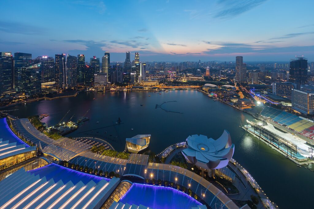 Singapore Marina Bay skyline with Marina Bay Sands and Financial District at dusk